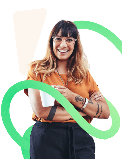 Recruitment marketing professional - woman with tattoos smiling and holding a cup of coffee